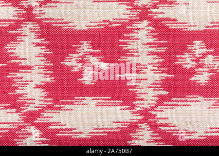 a fabric with abstract pattern. fiber texture polyester close-up. fine grain felt red fabric background. Stock Photo