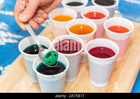 Coloring quail eggs with natural dyes for Easter, spring, Pas de Calais, France Stock Photo