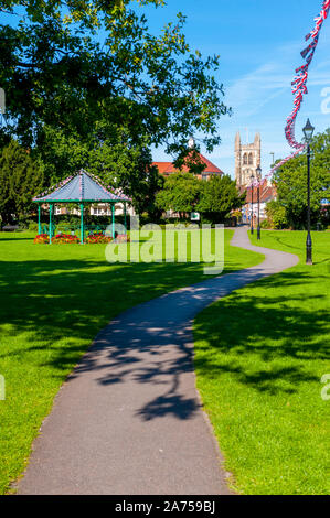 The bandstand in Gostrey Meadows Farnham Surrey with St Andrew's Parish Church in background. Stock Photo