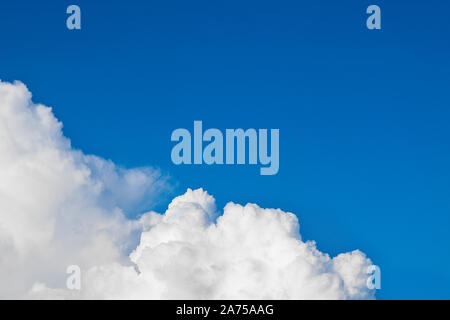 Cumulus clouds against the blue sky. Unique natural background. With copy space Stock Photo