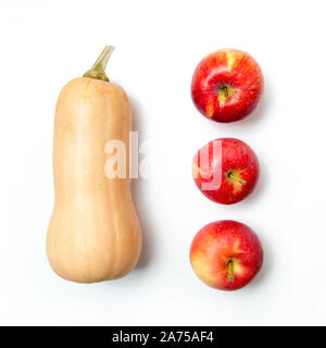 One pumpkin and three apples on a white background. Ingredients for diet salad or freshly squeezed juice. Stock Photo