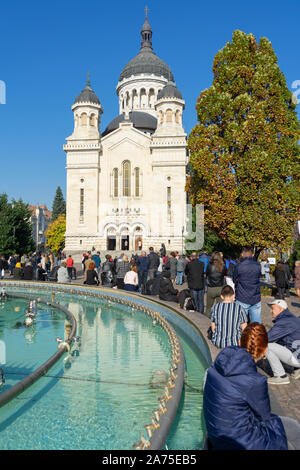 Cluj Napoca, Romania - 27 Oct, 2019: People attend the sunday mass outside the The Dormition of the Theotokos Cathedral in Cluj Napoca, Romania. Stock Photo