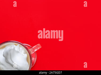 cream coffee in glass on red background shot from above Stock Photo