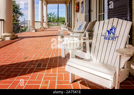 Adirondack chairs with the City of Biloxi logo invite guests to relax on the porch of the Biloxi Welcome Center, Oct. 22, 2019, in Biloxi, Mississippi. Stock Photo