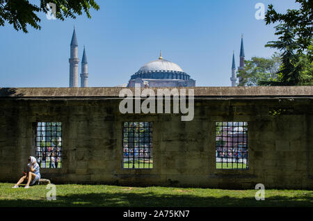 Istanbul: Hagia Sophia, former Greek Orthodox Christian patriarchal cathedral, later Ottoman imperial mosque, through the courtyard of the Blue Mosque Stock Photo