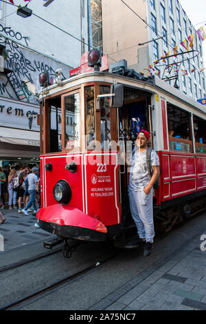 Istanbul: historic T2 Line Taksim-Tunel tram coming from Taksim Square on the rails of Istiklal Caddesi, one of the most famous avenues of the city Stock Photo