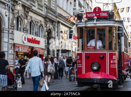 Istanbul: historic T2 Line Taksim-Tunel tram coming from Taksim Square on the rails of Istiklal Caddesi, one of the most famous avenues of the city Stock Photo