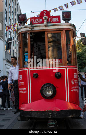 Istanbul: historic T2 Line Taksim-Tunel tram coming from Taksim Square on the rails of Istiklal Caddesi, one of the most famous avenues of the city Stock Photo