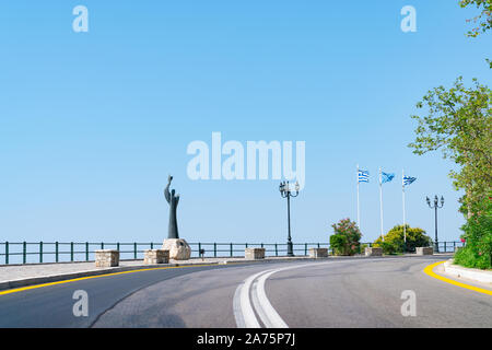 Delphi, Greece - July 28 2019; Modern statue on corner in road into city of Delphi Greece. Stock Photo