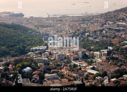 Cityscape of Trieste, Italy, with the university on the right and the seaport in the background Stock Photo