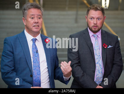 Edinburgh, 30 October 2019. Pictured: (left-right) Keith Brown MSP - Depute Leader of the Scottish National Party (SNP);, Jamie Green MSP - Shadow Cabinet Secretary for Transport, Infrastructure and Connectivity. Scenes from inside the Scottish Parliament in Edinburgh.  Credit: Colin D Fisher/CDFIMAGES.COM Stock Photo