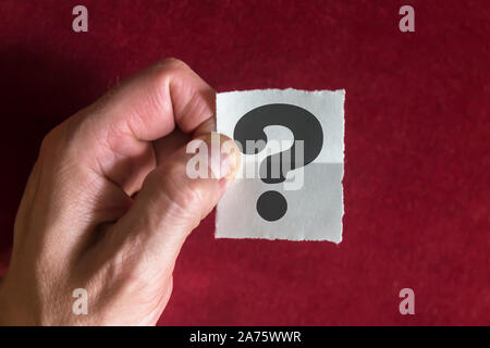 Black Question Mark Printed on an Paper Note Stock Photo