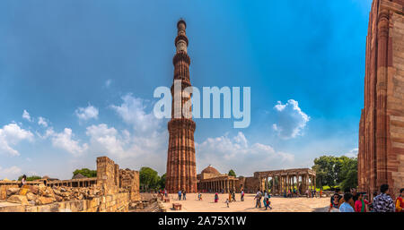 The Qutb Minar, also spelled as Qutab Minar or Qutub Minar and the ruined buildings Stock Photo
