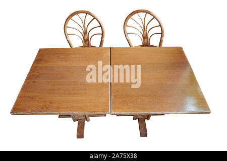 Two rustic and textured wooden table with chairs, view in perspective isolated with clipping path Stock Photo
