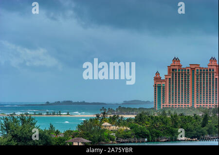 Views of Paradise Island where Atlantis Resort can be seen from a cruise ship entering Nassau's Harbor under stormy skies. Stock Photo