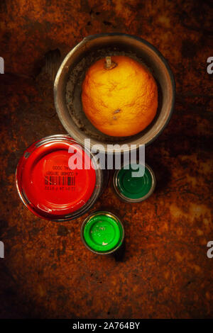 four colour cans with orange red and green colors Stock Photo