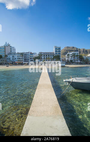 A beautiful water view and a boat docking in a dock at Puerto De Pollensa beach in Palma De Mallorca , Spain. Stock Photo