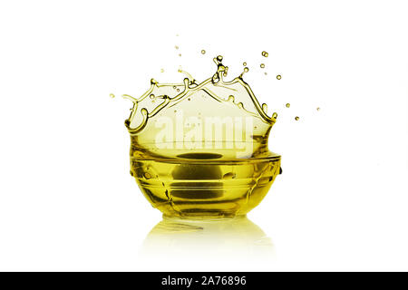 Olive oil in a glass bottle and green olives on white, top view. Stock Photo