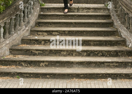 Hue, Thua Thien-Hue, Vietnam - February 27, 2011: Tourist walking down the staircase at Forbidden Purple City in Hue, a city in central Vietnam Stock Photo