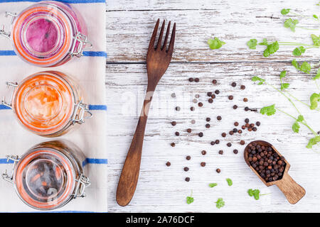 Homemade Marinated Sauerkraut Sour In Glass Jars On Rustic Wooden Kitchen Table Stock Photo