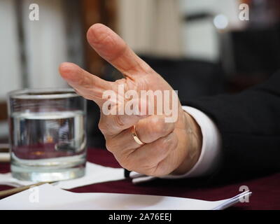 A hand of Ernesto Blume Fortini, president of the Constitutional Tribunal of Peru, when giving a press conference to foreign correspondents accredited in Lima. Stock Photo