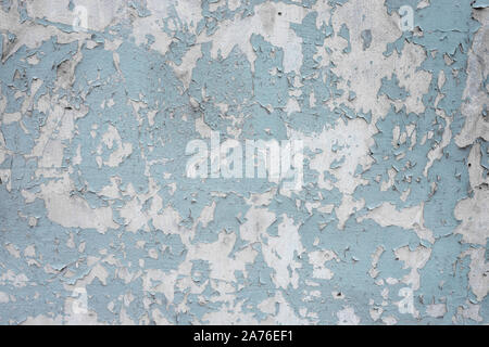 An old ragged blue plaster wall texture Stock Photo