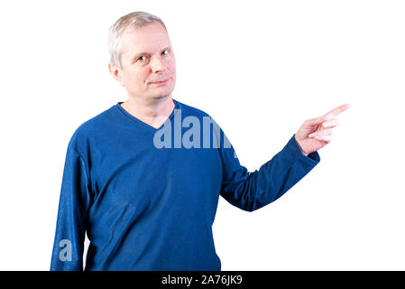 An elderly man points his finger to the right. Isolated on a white background. Stock Photo