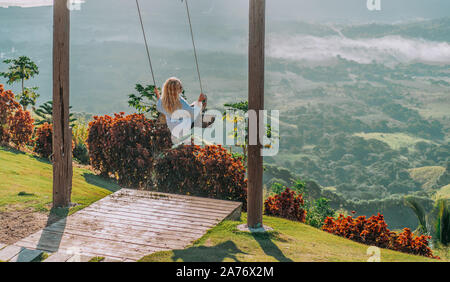 Beautiful view of young woman swing on the top of the mountain Redonda in Dominican Republic. Concept travel, vacation, tourism Stock Photo