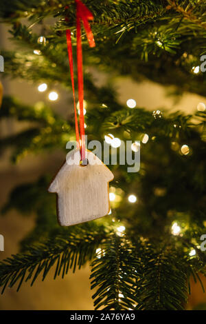 Christmas tree decorated with gingerbread cookies and garland Stock Photo
