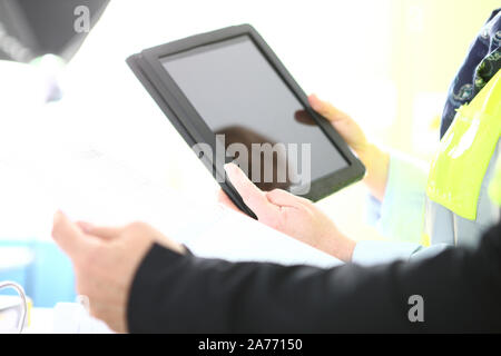 people at work with a table and papers Stock Photo