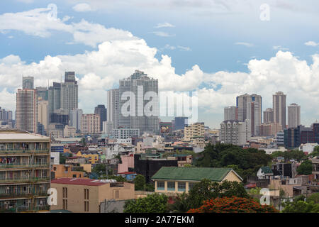 Manila, Philippines - June 7, 2017: Cityscape of Manila: slums ghetto and skyscrapers Stock Photo