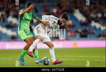 Madrid, Spain. 31st Oct, 2019. Real Madrid CF's Isco Alarcon and CD Leganes's Roberto Rosales competes for the ball during the Spanish La Liga match round 11 between Real Madrid and CD Leganes at Santiago Bernabeu Stadium.(Final score: Real Madrid 5 - 0 Leganes) Credit: SOPA Images Limited/Alamy Live News Stock Photo