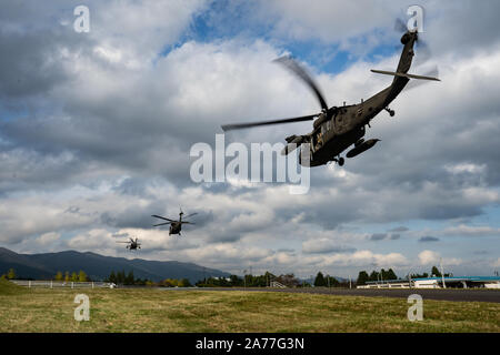 U.S. Army Sikorsky UH-60 Black Hawks take flight during Black Hawk integration training as part of exercise Fuji Viper 20-1 on Camp Fuji, Japan, Oct. 28, 2019. Fuji Viper is a regularly scheduled training evolution for infantry units assigned to 3rd Marine Division as part of the unit deployment program. The training allows units to maintain their lethality and proficiency in infantry and combined arms tactics. (U.S. Marine Corps photo by Cpl. Timothy Hernandez) Stock Photo