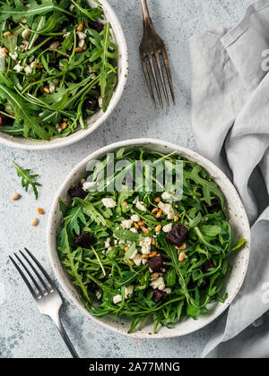 Beetroot, aragula and soft cheese salad over gray background. Top view or flat lay. Copy space for text. Idea and recipe for healthy vegetarian summer salad. Clean eating diet concept Stock Photo