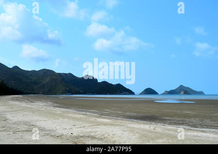 Low tide on the beach with Sam Roi Yot National Park in the distance at Sam Roi Yot  Prachuap Khiri Khan Thailand Stock Photo