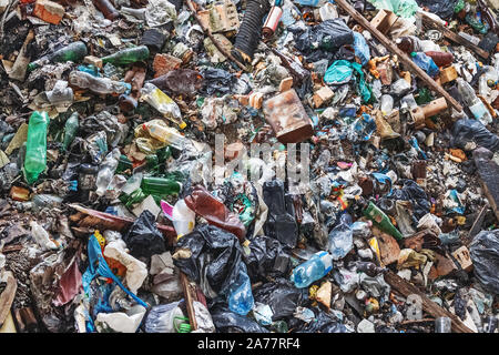 Background of garbage waste with a huge amount of used packaging from household products and food. Stock Photo