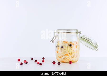 Sauerkraut in glass mason jar. Homemade sauerkraut with carrot . Fermented food. Natural probiotic. Copy space. Stock Photo