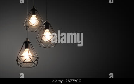 Decorative ceiling lights / hanging lights on dark background with copy space Stock Photo