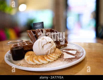 Dessert - Gelato ice cream with chocolate waffle and banana Stock Photo