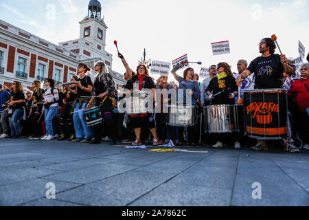 Protesters playing drums during the demonstration. Thousands of people gathered at Puerta del Sol to protest against precariousness and low pensions for elder people. Marches from Bilbao (northern Spain) and Rota (southern Spain) met at the country's capital to protest in front of Spanish Parliament. Stock Photo