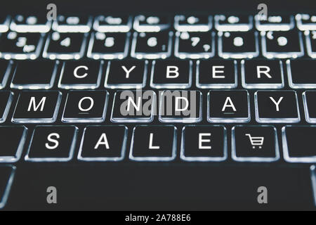 Text cyber Monday on your keyboard in the dark. The concept of online sales on the day following black Friday. online shopping. Stock Photo