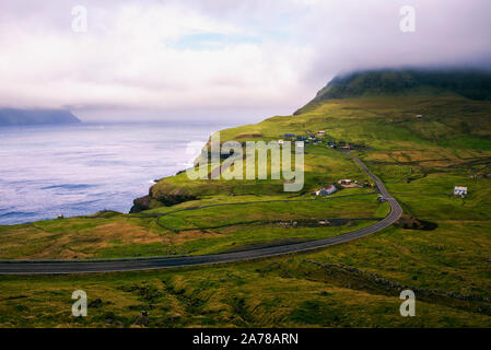 Road going to Gasadalur village in Faroe Islands Stock Photo