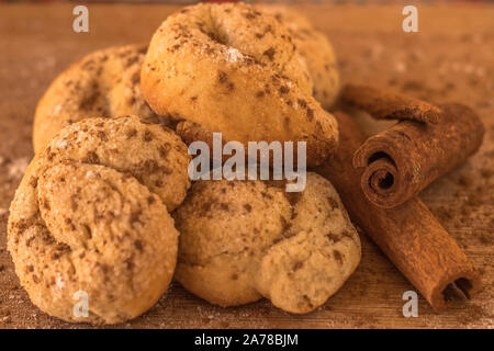 homemade cookies with sugar and cinnamon on wooden table with cinnamon stick with space for text Stock Photo