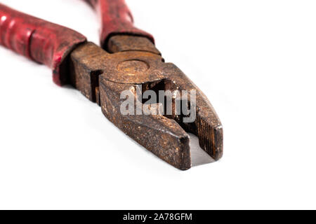 Classic diagonal pliers on a wood table - isolated Stock Photo