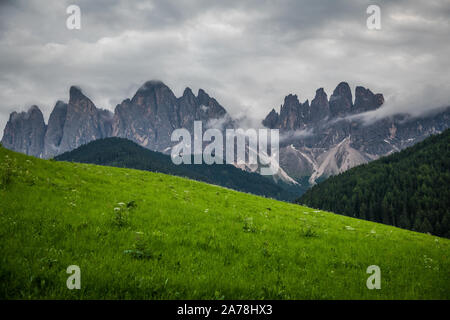 Dolomites, Italy - July, 2019: Famous best alpine place of the world, Santa Maddalena village with Dolomites mountains in background, Val di Funes val Stock Photo