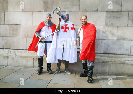 London UK. 31 October 2019. Pro Brexit protesters dressed as crusaders protest  in Parliament Square on the day Brexit deadline passes when Britain was supposed to leave the European Union on 31 October. The EU has granted  Britain an extension until January 2012. amer ghazzal /Alamy live News Stock Photo