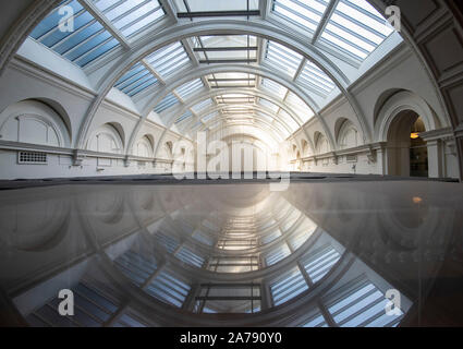 Reflections of the ceiling in the Victoria and Albert Museum, London England UK