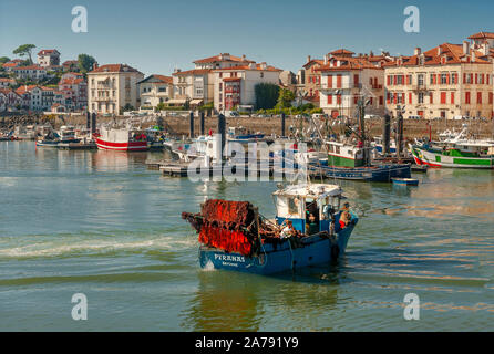 Tuna trawler heading out to fish in the French port of Sant-Jean-de-Luz at the Côte Basque. Stock Photo