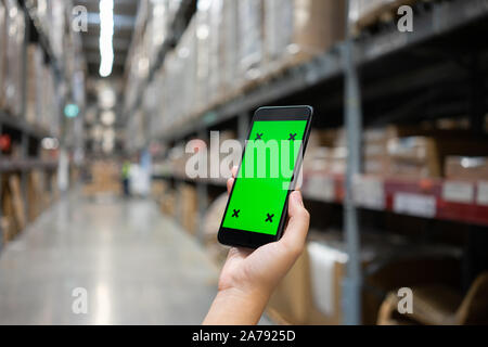 Mockup image of Woman hand holding mobile smartphones isolated white screen for mockup design and others app display background. Graphic design montag Stock Photo