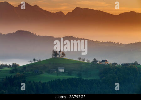 Autumn landscape of a beautiful church on the top of a hill, in Slovenia Stock Photo